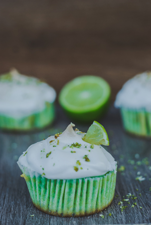 sweet homemade muffins stuffed with meringue and lime peel