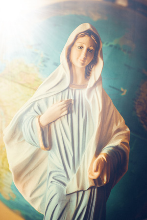 the Virgin Mary in front of Earth の写真素材