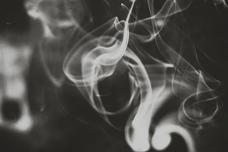 ghosts white smoke abstract on black backgroundの写真素材