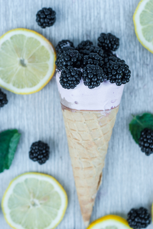 Tasty ice cream with berries in waffle conesの写真素材