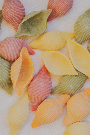 closeup of gluten free vegetable pasta on wooden background.の写真素材