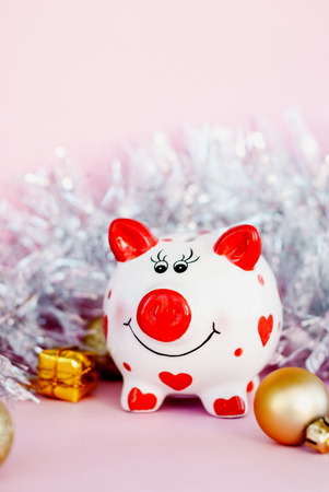 Piggy bank over pink background with christmas decoration copy space. Year of pig 2019.の写真素材