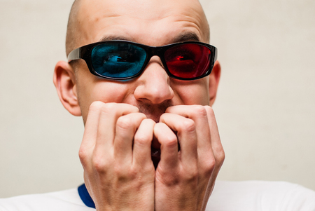 Portrait Of A Young Man Wearing 3d Glasses On A white Backgroundの写真素材