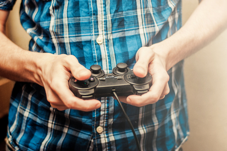 Man playing on the joystick in a game console
