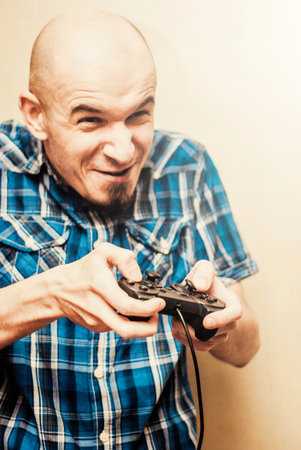 Man playing on the joystick in a game console