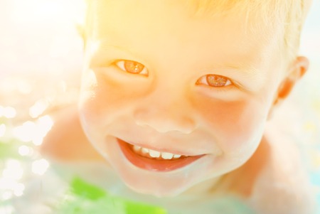 Portrait of baby boy enjoying swimming in poolの写真素材