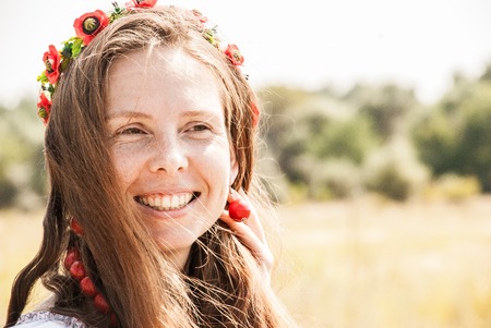 Pretty woman dressed in embroidered clothesの写真素材