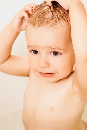 happy funny baby laughing and bathedの写真素材