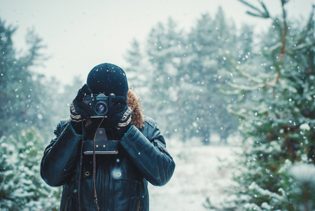 Young man with vintage cameraの写真素材
