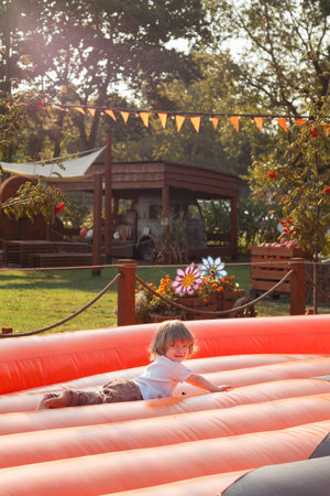 Toddler Jumping on Outdoor Trampolineの写真素材