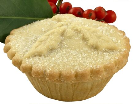 A traditional mince pie with a sprig of hollyの写真素材