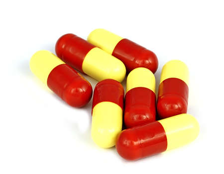Red and yellow flu tabletsの写真素材