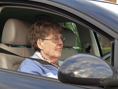 Mature female driving carの写真素材