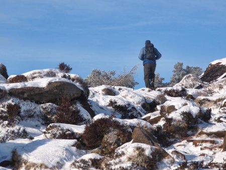 A walker at the roaches, Peak District, in winterの写真素材