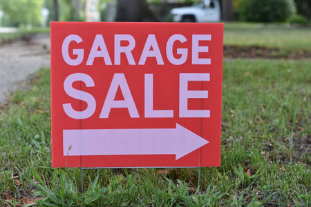 Garage Sale Sign in Grass with Arrow Pointing Right, Small Town USAの写真素材