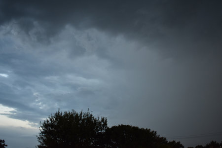 Dark Storm Clouds Building over Midwest Townの写真素材