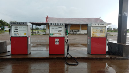 Three Old Gas Pumps Outside of an Abandoned Gas Stationの写真素材