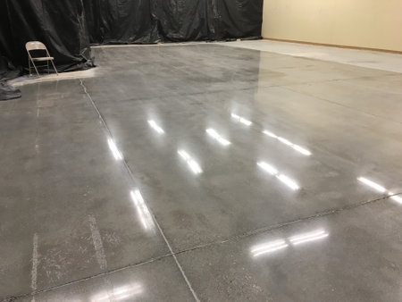 Shiny Fluorescent Light Reflections on Newly Polished Concrete Floorの写真素材