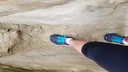Legs of Woman Hiking through Slot Canyon, Annies Canyon, Encinitas, California
