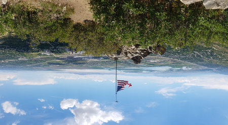 American Flag Flying High on a Mountain, Flag Rock, Near Salt Lake City, Utahの写真素材