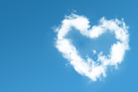 Fluffy heart on blue skyの写真素材