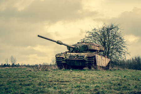 Old tank in autumn natureの写真素材
