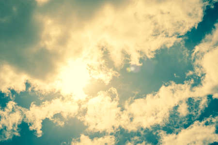 Shinin sun coming through some cloudsの写真素材