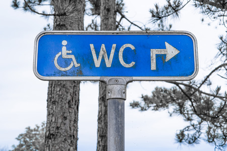 Grunge toilet sign outdoors in blue colorの写真素材