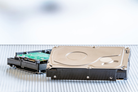 Harddisks on a metal surface in blue light