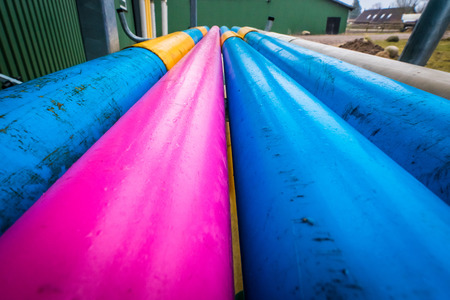 Colorful pipes at a farm on a rainy dayの写真素材