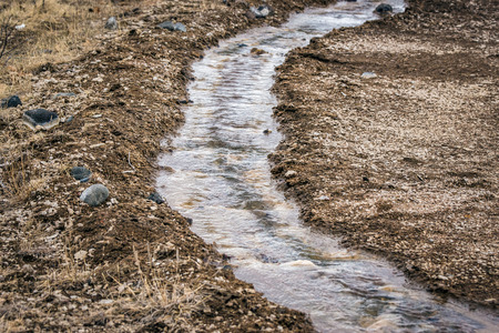 Small stream with pebbles in icelandic nature