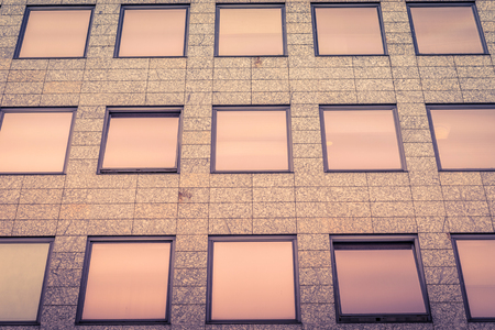 Office windows in shiny bronze colors on a building