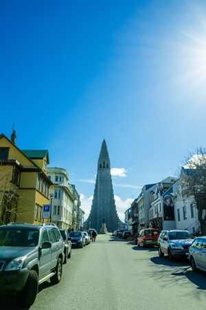 REYKJAVIK, ICELAND - APRIL 9 - 2016: Hallgrimskirkja at the end of the street in Reykjavikのeditorial素材