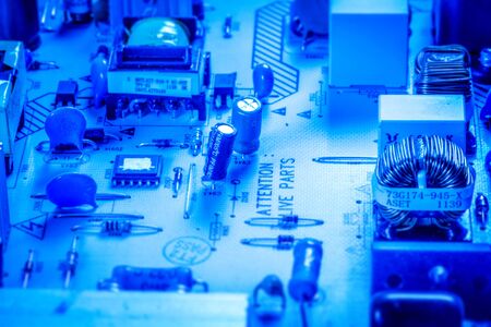 Microcircuit board with chips and capacitors in blue colorの写真素材