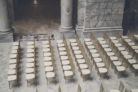 Empty chairs in a large elegant room