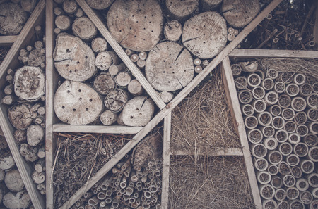Abstract background with wood logs on a shelf with hay