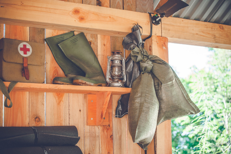 Retro survival kit in a wooden cabin in the natureの写真素材