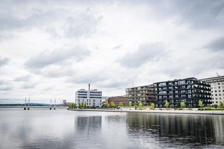 JÃ¶nkÃ¶ping, Sweden - JULY 30 - 2017: Urban lake view in JÃ¶nkÃ¶ping with buildings and a bridgeのeditorial素材