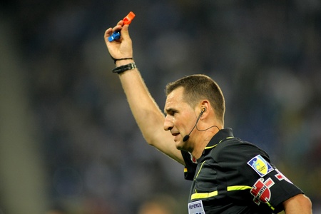 Referee Clos Gomez indicates kick off after he blows the whistle during a Spanish League match between Espanyol and Valencia at the Estadi Cornella on May 11, 2011 in Barcelona, Spainのeditorial素材