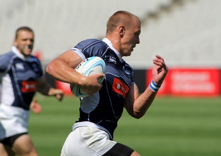 Denis Simplikevich of Russia drives the ball  during the match of Rugby7 European Championship between Russia and Moldavia at the sports competition Stadium in Barcelona, on July 9, 2011のeditorial素材
