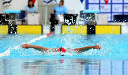 Powerful male swimmer swimming butterfly stroke