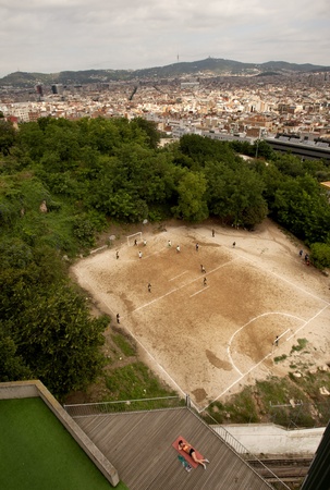 Barcelona citizens playing soccer in one the cities with the most better professional soccers players, at Monjuitch Mountain, July 24, 2011 in Barcelona, Spainのeditorial素材