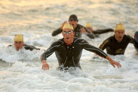 Brenton Cabello of Spain in action finishing swimming at Barcelona Garmin Triathlon event at Barcelona beach on October 16, 2011 in Barcelona, Spainのeditorial素材