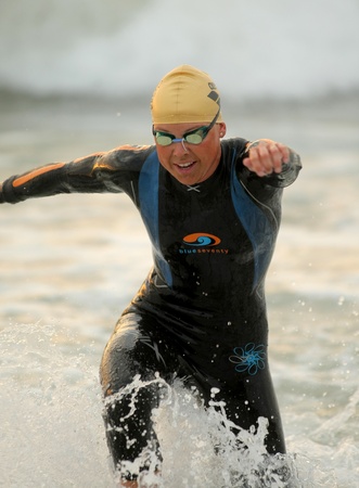 Michelle Vesterby of Denmark in action finishing swimming at Barcelona Garmin Triathlon event at Barcelona beach on October 16, 2011 in Barcelona, Spainのeditorial素材