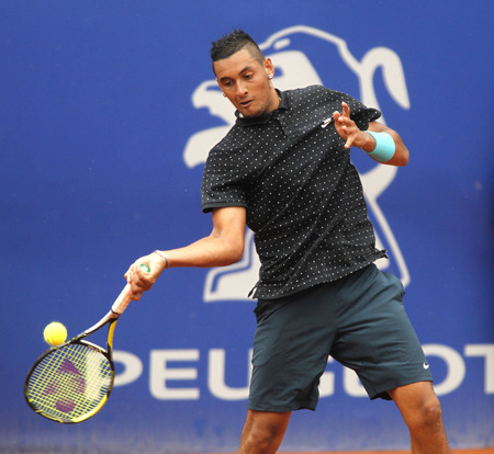 Australian tennis player Nick Kirgios in action during a match of Barcelona tennis tournament Conde de Godo on April 22 2015 in Barcelonaのeditorial素材