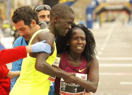 Florence KiplagatR with Abel KiruiL after to break half Marathon world record during Barcelona Half Marathon in Barcelona on February 15, 2015 in Barcelona, Spain.のeditorial素材