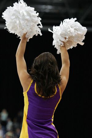A cheerleader using palm plams.の写真素材