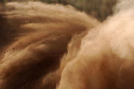 A motorsport rally dust cloud fills the space.の写真素材