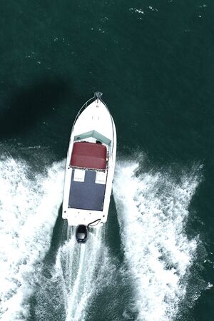 A speed boat runs through the ocean.の写真素材
