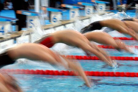 Men's backstroke start with action and blur.の写真素材